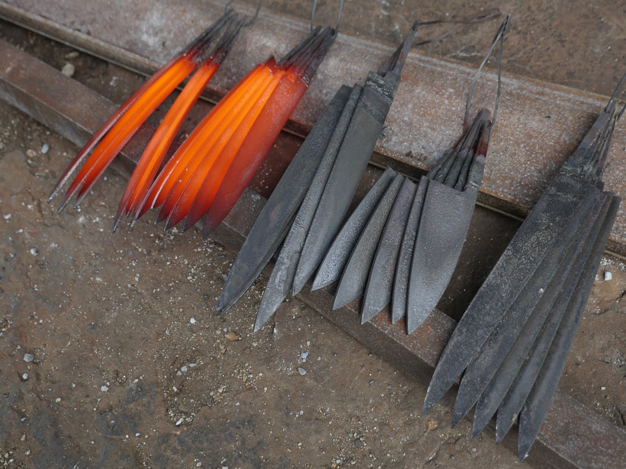 Forged knife blanks cooling on wire hangers in Shigeki Tanaka's Miki workshop, 2016